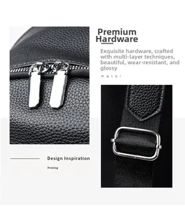Close-up of black lychee grain leather backpack with silver hardware and dual zippers