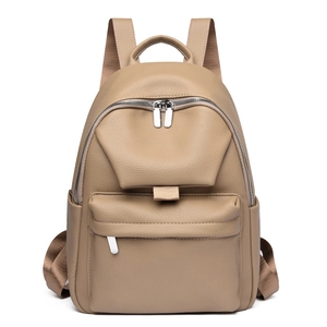 Front view of khaki pebbled leather backpack with silver zippers and multi-pocket design