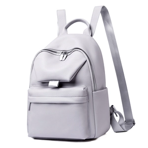 Detailed side view of light purple litchi grain leather backpack with silver zippers