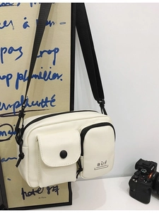 Minimalist beige crossbody phone bag with multi-pocket design and adjustable strap