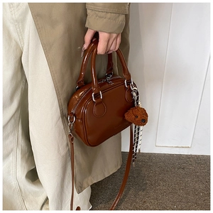 Glossy brown patent leather small square bag with cute plush bear charm detail