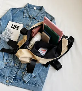 Detailed interior of the large canvas travel tote showing multiple pockets and capacity