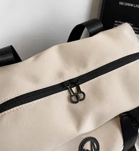Detail of the high-density waterproof nylon fabric and smooth double zipper on travel bag