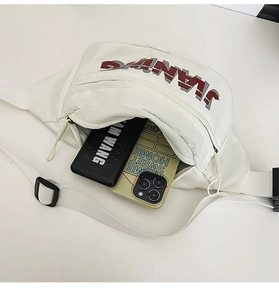 Detailed interior of the white PU leather sling bag showing phone and power bank storage