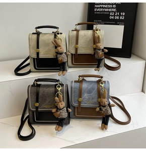 Collection of vintage crossbody bags with contrast trim and cute rabbit doll charms