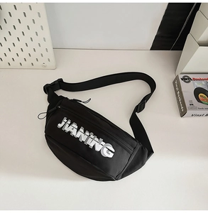Detail of black sports waist bag featuring white JIANING logo and adjustable strap