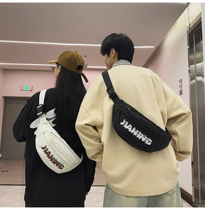 Detail of casual sports chest bags with JIANING logo in white and black colors