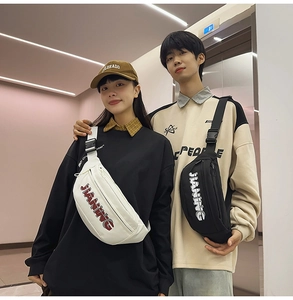 Close-up of black and white cross-body chest bags with JIANING logo and adjustable straps