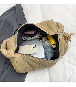 Spacious khaki quilted puffer bag showing organized interior storage for daily essentials