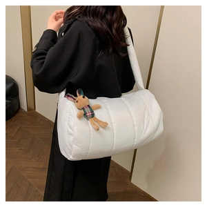 Quilted white puffer shoulder bag with a cute brown plaid bunny plush charm detail