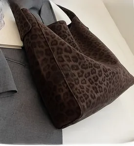 Detail of soft leopard print tote bag with fuzzy texture and spacious interior design