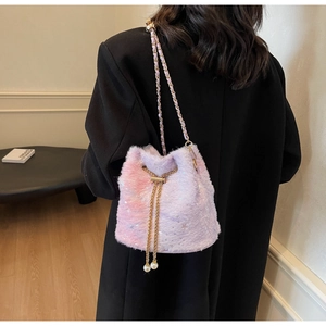 Close-up of plush bucket bag featuring purple gradient faux fur and pearl drawstring charms