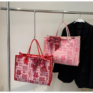 Detailed shot of large bridal tote bags with Chinese double happiness pattern and silk scarves