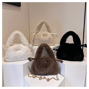 Detail showing plush faux fur bucket bags in four colors with gold metal chains