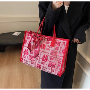 Detail of red wedding tote bag with Double Happiness print and silk scarf decor