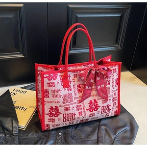 Detailed close-up of wedding tote bag featuring red Double Happiness pattern and silk bow