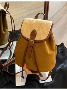 Brown faux suede backpack with white faux shearling flap and adjustable leather straps
