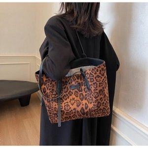 Leopard print tote bag worn by model showing large capacity and stylish retro design