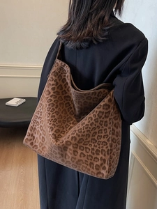 Leopard print tote bag for women featuring a spacious design and wide shoulder strap