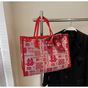 Detail of red wedding tote bag with double happiness character and satin bow knot