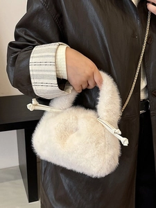 Chic cream faux fur bucket bag with golden chain strap for autumn winter fashion