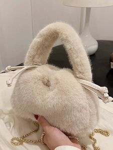 Cream plush faux fur bucket bag with a gold chain strap and drawstring for autumn winter