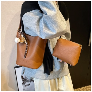 Brown lychee grain leather bucket bag set with baseball charm and small square pouch