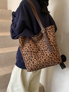 Large leopard print tote bag with adjustable brown leather shoulder strap for women