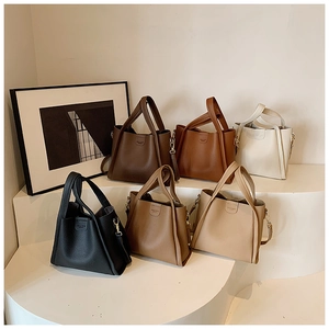Selection of large capacity bucket tote bags in diverse earthy colors with textured finish
