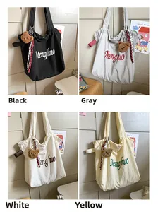 Detailed view of four canvas tote bag colors featuring bear charms and silk ribbons