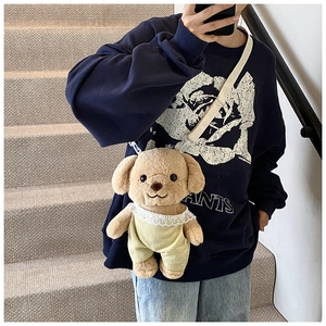 Close-up of cute plush poodle shoulder bag with lace dress and adjustable strap