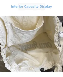 Detail view of the drawstring interior with pocket and texture of this white tote bag