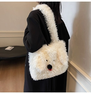 Detail view of a white fluffy dog-shaped plush tote bag with a cute red tongue accent