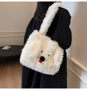 Detail of white plush puppy tote bag on model back with contrasting black coat background