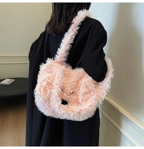 Detail showing plush pink faux fur tote bag with cute animal face and long shoulder strap