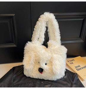 Close-up of white plush puppy tote bag with fluffy faux fur and cute animal face features