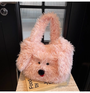 Detail of pink plush dog-shaped tote bag showing soft faux fur texture and cute puppy face