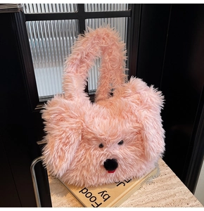 Detailed texture of a pink plush poodle-shaped tote bag on a marble table