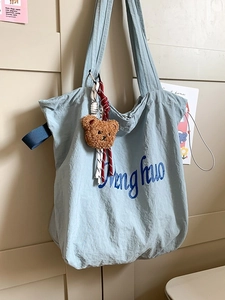 Light blue large capacity tote bag with bear charm and Ding huo text for daily use
