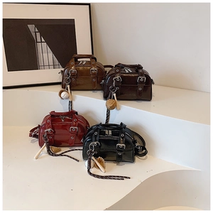 Retro mini Boston bags with shiny faux leather texture and baseball glove pendants