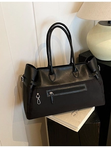 Large black tote bag with mixed materials and front zipper for office and casual use