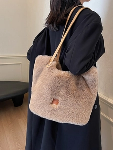 Chic faux fur tote bag in light brown with leather straps and central brand patch