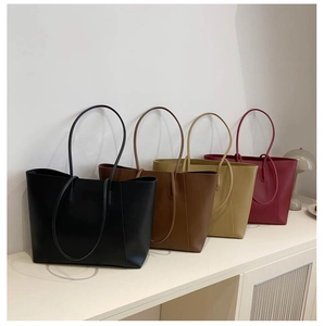 Selection of large minimalist tote bags in black, brown, khaki, and burgundy faux leather