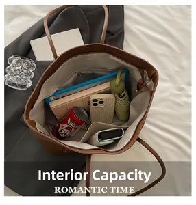 Top view of the spacious brown leather tote bag interior with multiple storage compartments