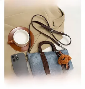 Retro blue denim mini satchel with brown leather handles and cute plush bear charm
