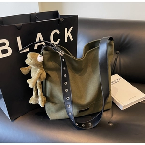 Fashionable army green canvas tote bag with black leather strap and frog plush charm