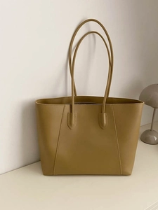 Minimalist large olive green leather tote bag for women with decorative stitching detail