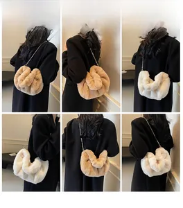 Detail view of white and khaki faux mink fur cloud bags with delicate metal chains