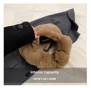 Detail showing internal capacity and zipper of brown plush faux fur handbag on suit jacket