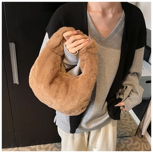 Detailed view of the soft brown faux fur texture on this plush winter crescent handbag